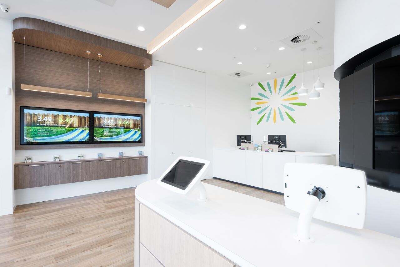 Modern, Bright Bank Interior With Screens, Counters, and Logo — ATH Projects in Kirrawee, NSW