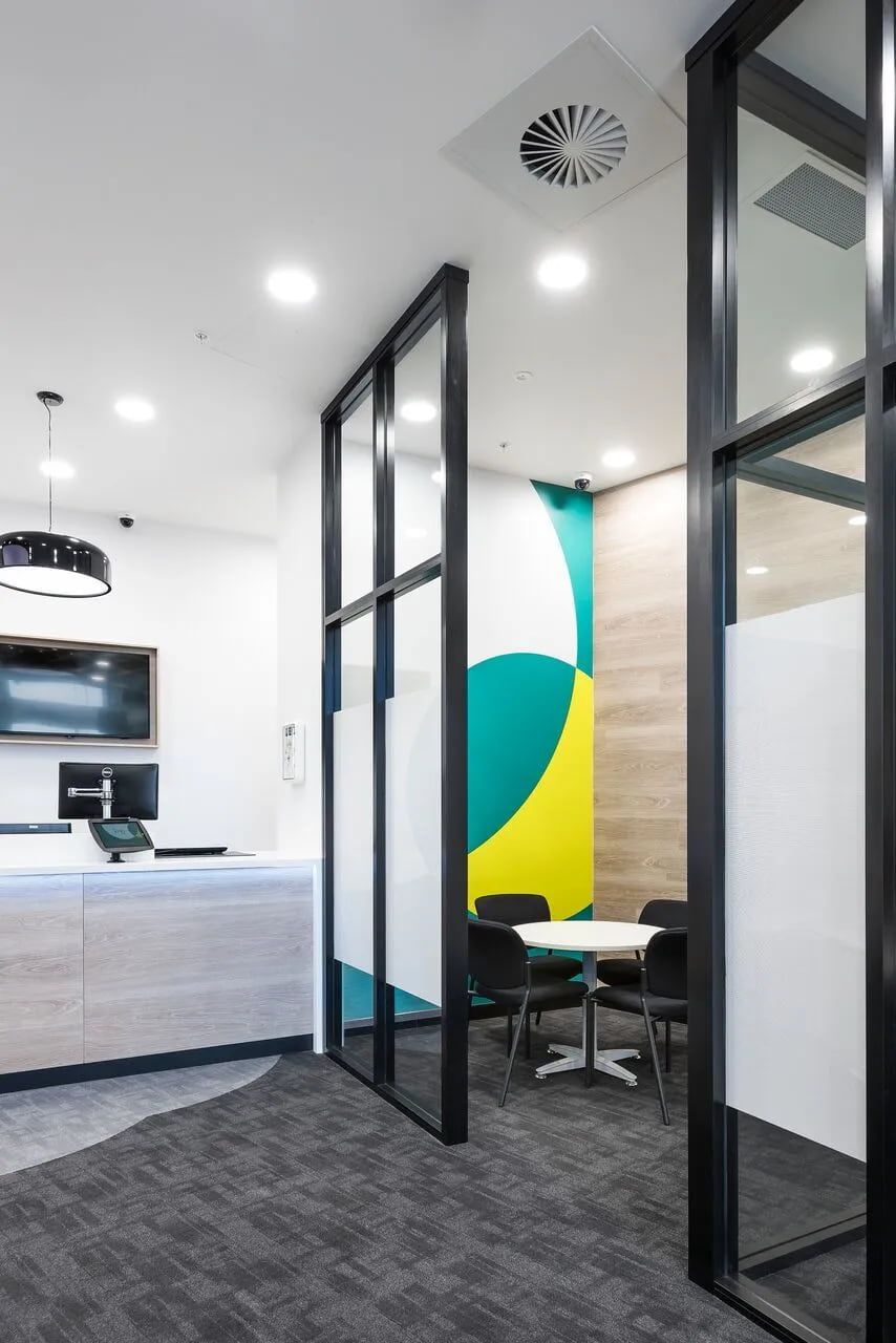 Modern Office Interior With Glass-walled Meeting Space, White Table, and Black Chairs — ATH Projects in Kirrawee, NSW