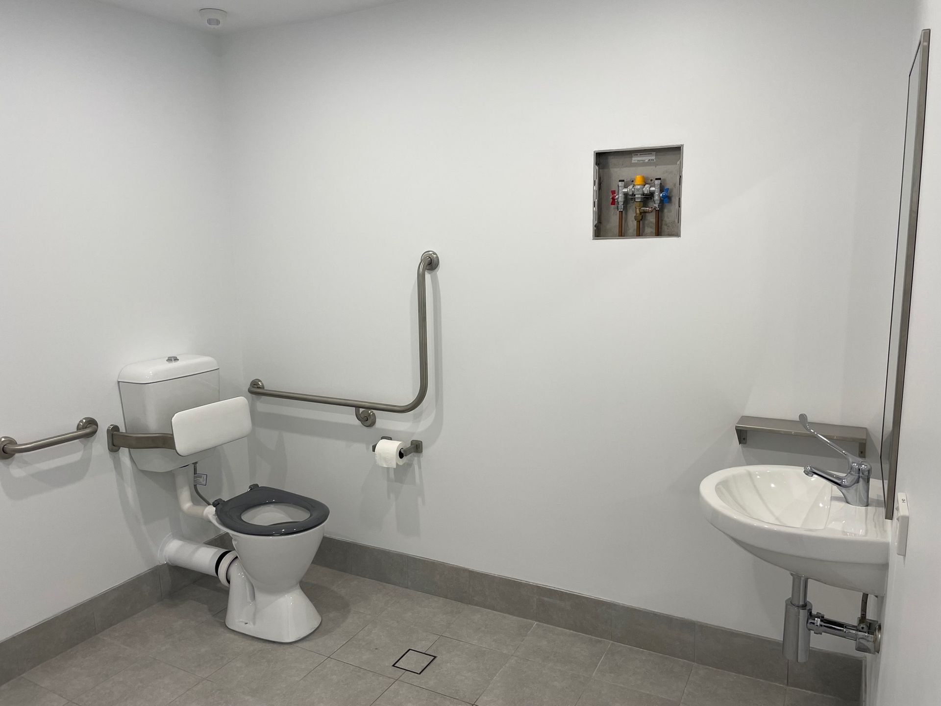 Accessible Restroom With Toilet, Sink, and Grab Bars — ATH Projects in Kirrawee, NSW