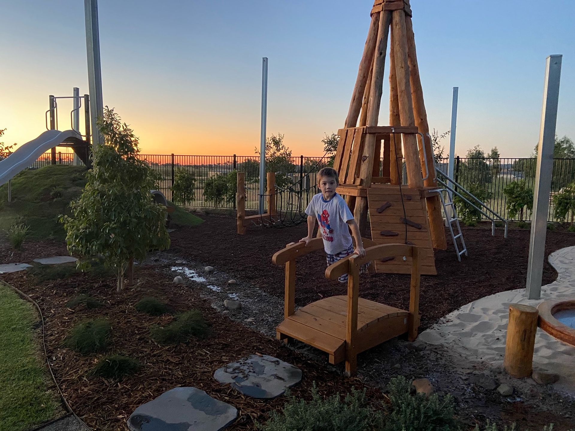 Boy Stands on a Wooden Bridge — ATH Projects in Moore Creek, NSW