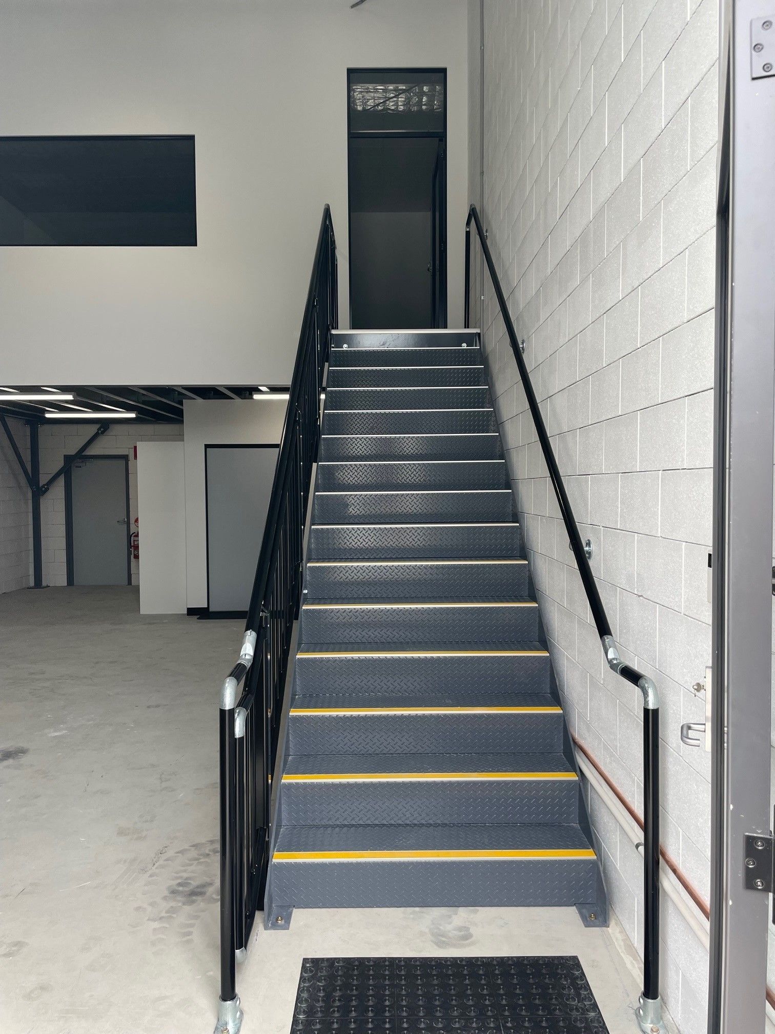 Staircase With Black Metal Railing — ATH Projects in Kirrawee, NSW