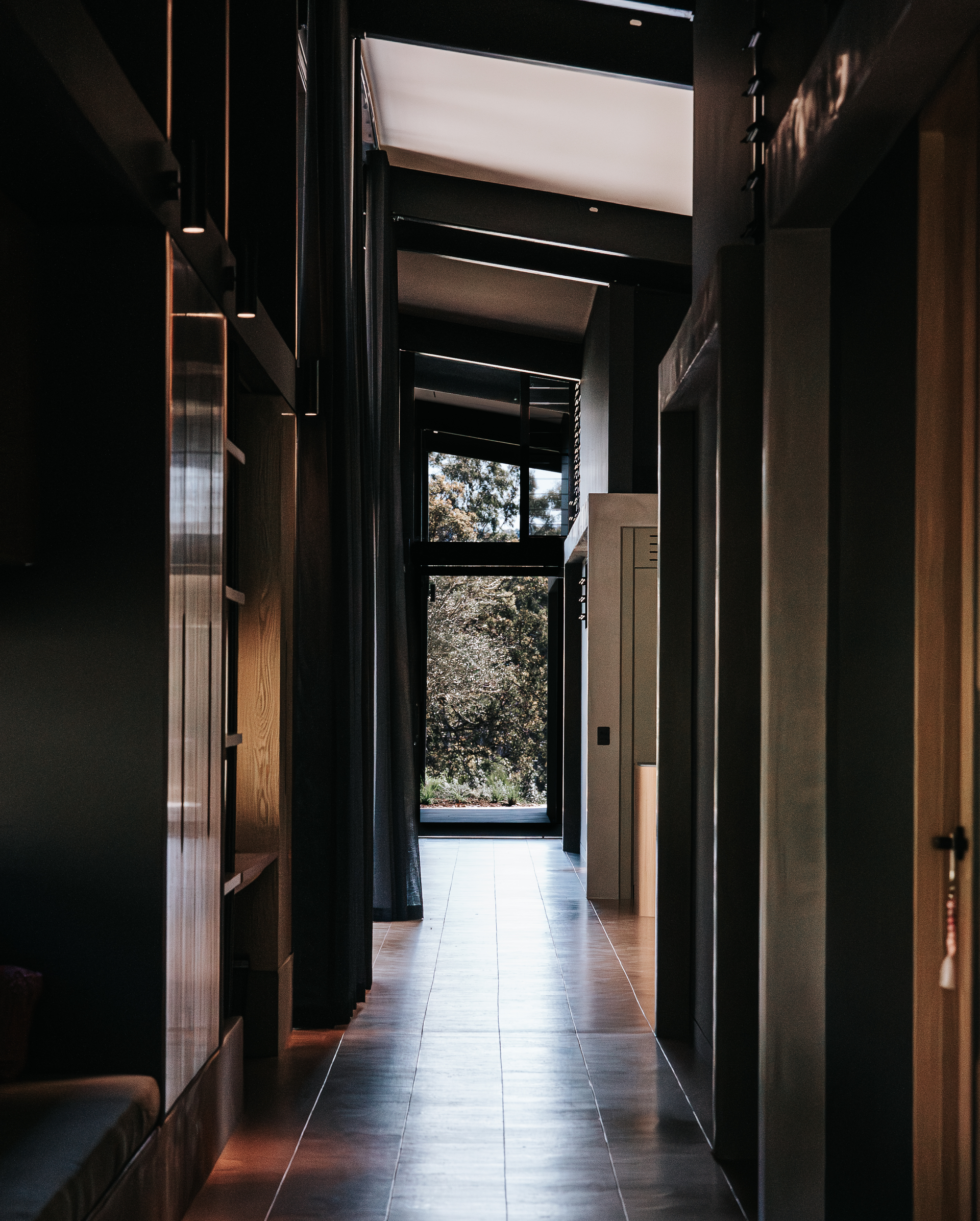 Long, Dark Hallway With Wooden Floor — ATH Projects in Eerwah Vale, QLD