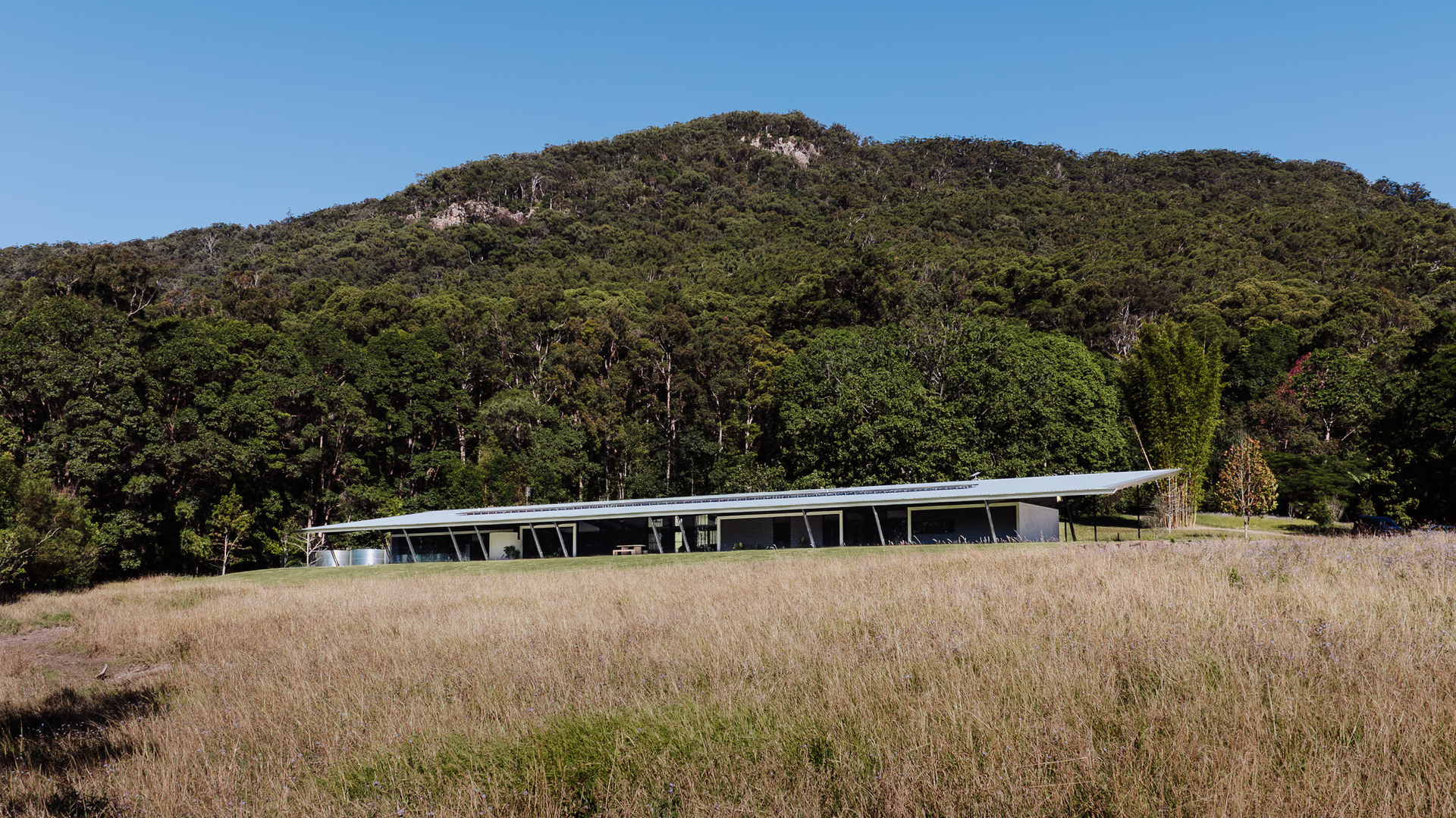 Long, Low Building With a Dark Roof in a Grassy Field — ATH Projects in Eerwah Vale, QLD