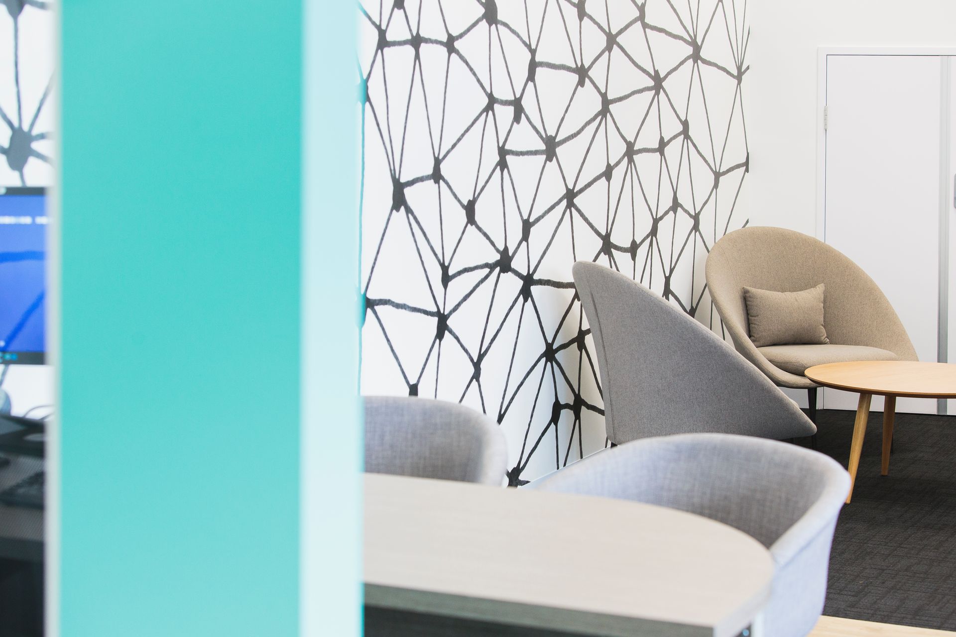 Modern Office Lounge With Geometric Wall Design, Chairs, and Table — ATH Projects in Kirrawee, NSW