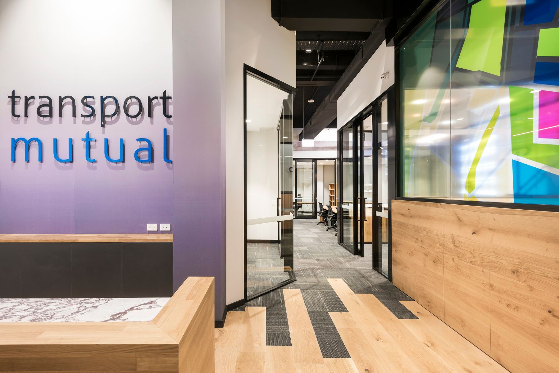 Office Reception Area With Transport Mutual Logo — ATH Projects in Kirrawee, NSW