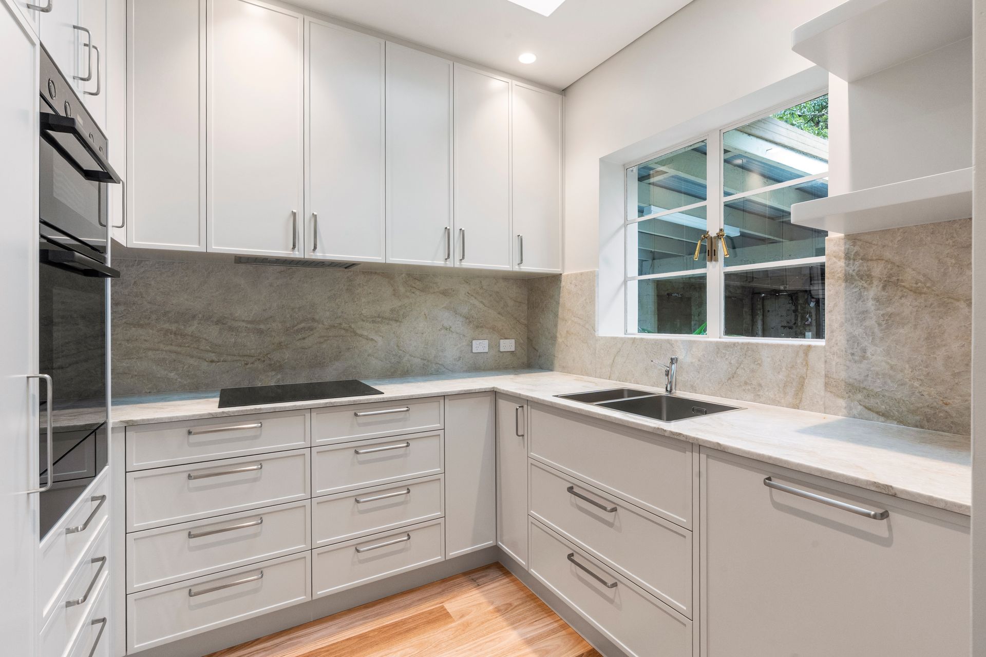 Modern White Kitchen With Granite Countertops — ATH Projects in Mosman, NSW