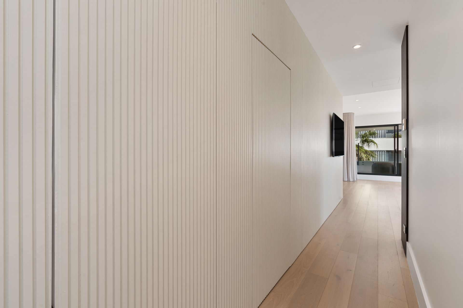 Long, White Hallway With Light Wooden Floors — ATH Projects in Cronulla, NSW
