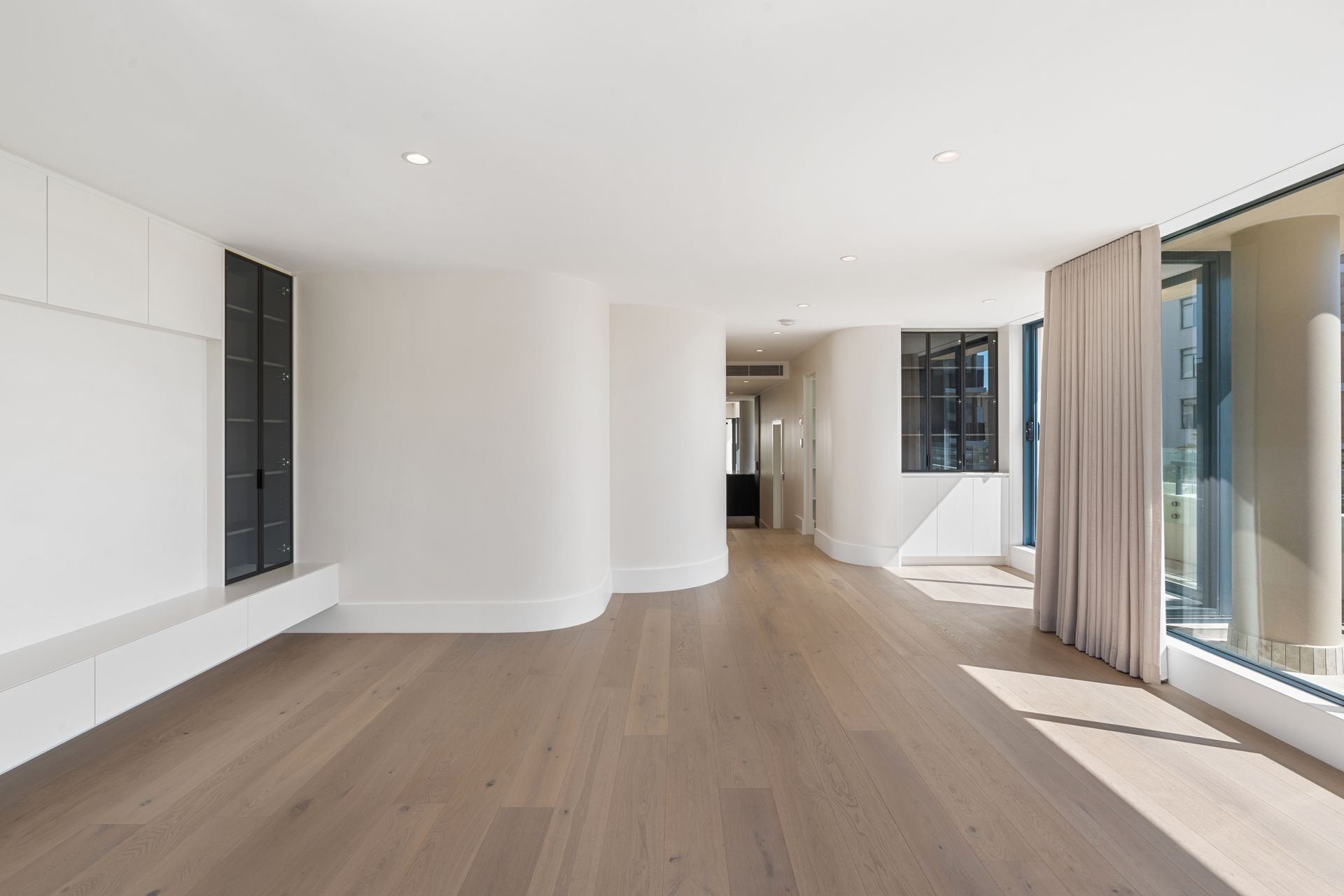 Empty, Bright Room With Curved Walls — ATH Projects in Cronulla, NSW
