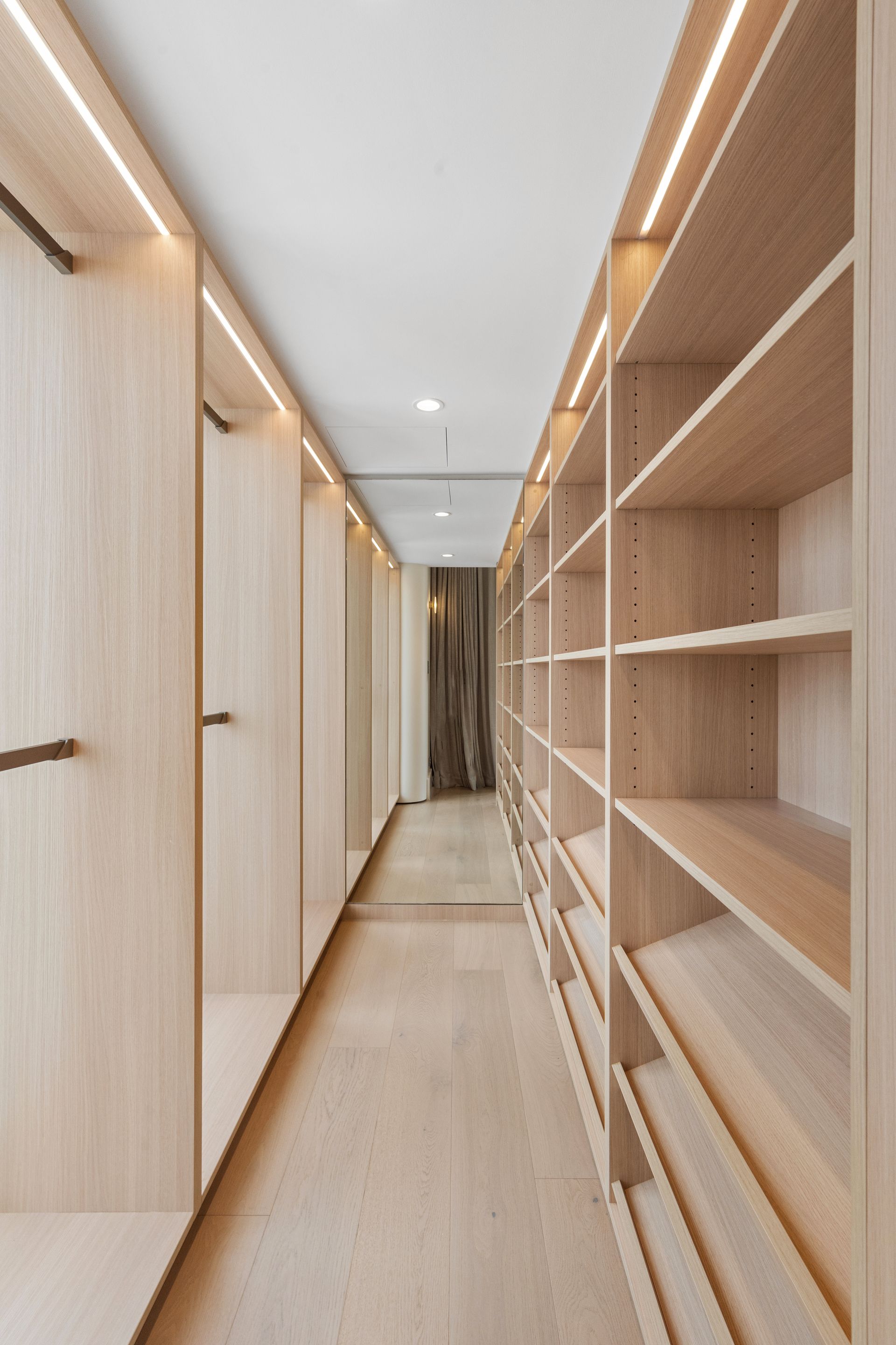 Walk-in Closet With Light Wood Shelves and Hanging Rods — ATH Projects in Cronulla, NSW