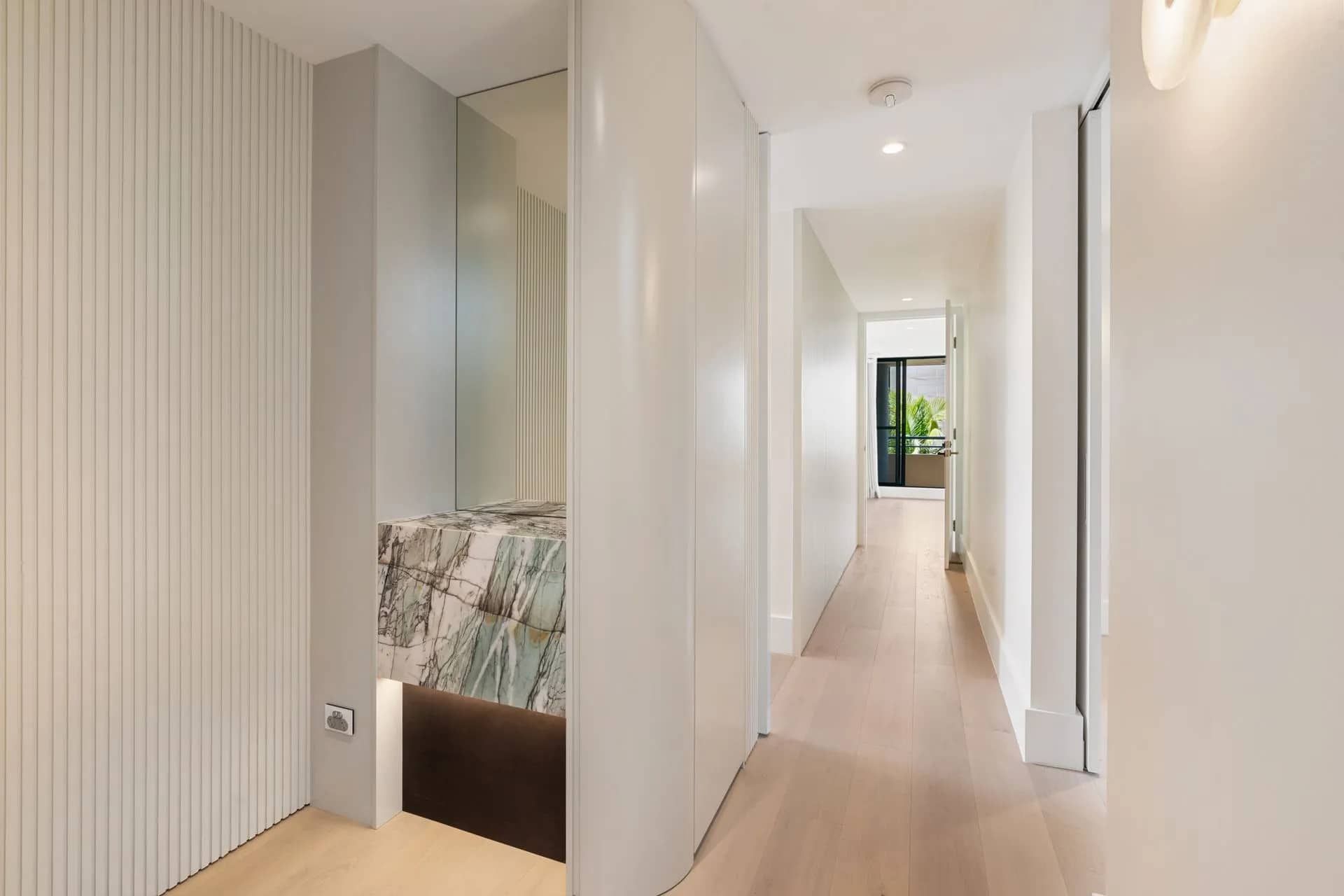 Hallway With Light Wood Floors, Leading to a Door With Greenery — ATH Projects in Kirrawee, NSW