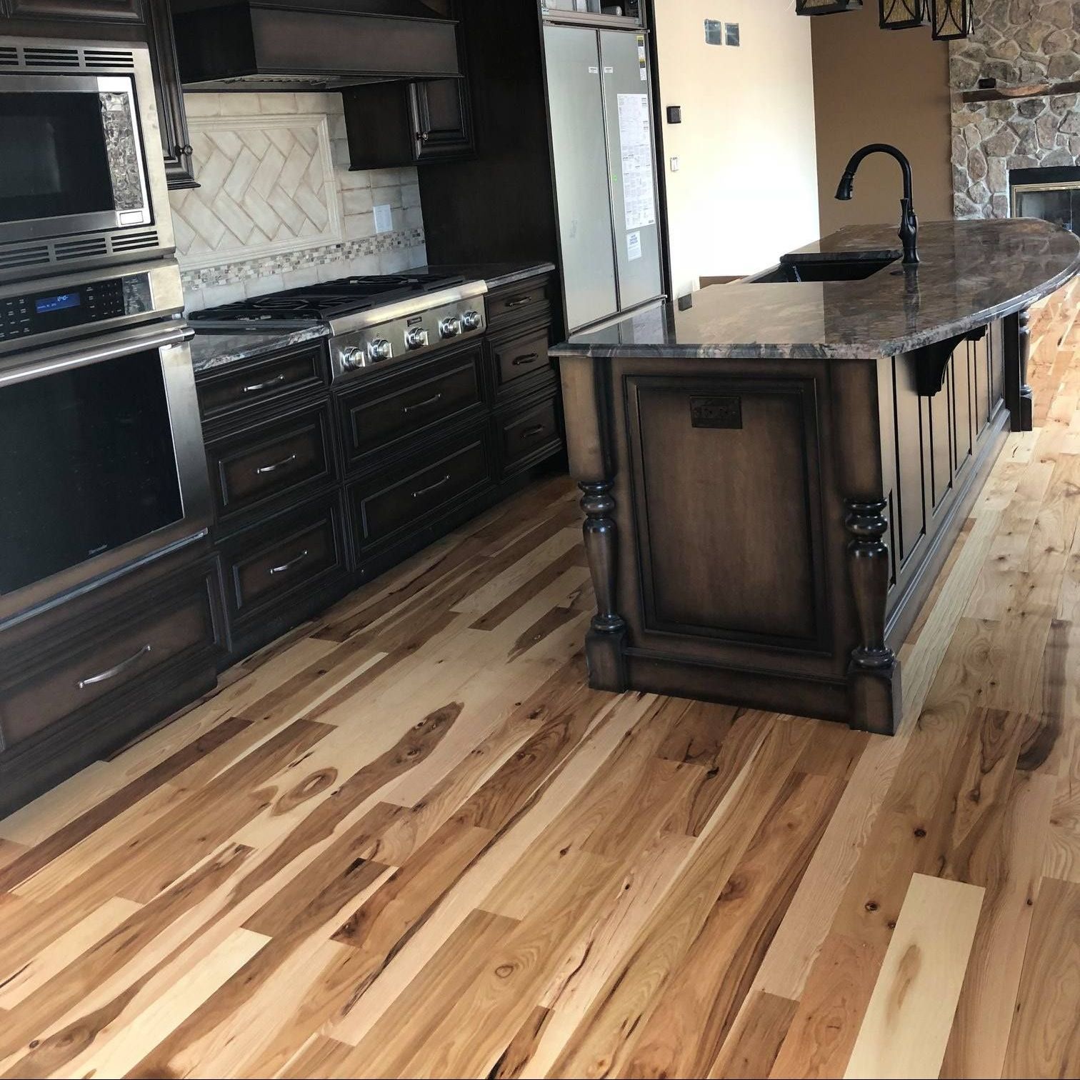 A & R Home Services remodel  kitchen with a large island 