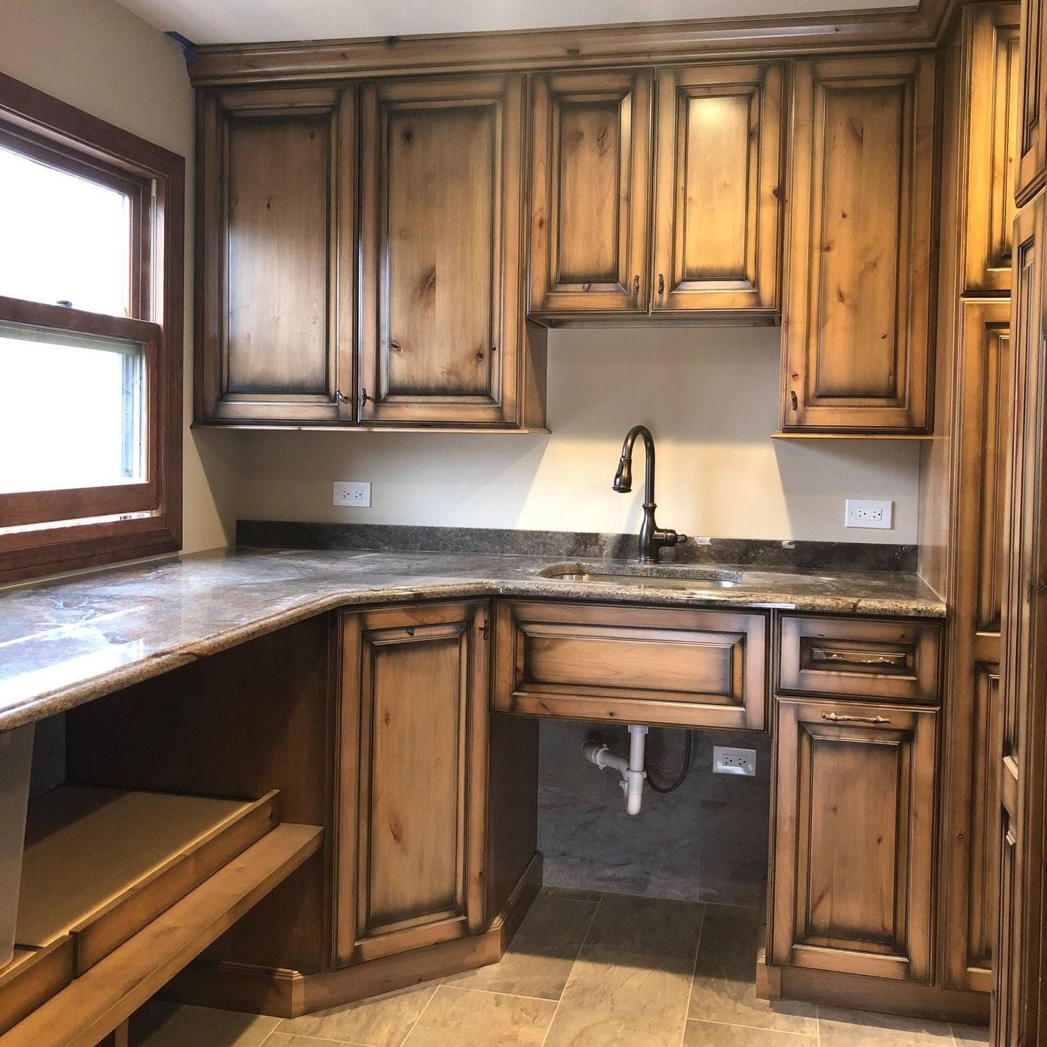 A & R Home Services remodel kitchen with wooden cabinets and granite counter tops