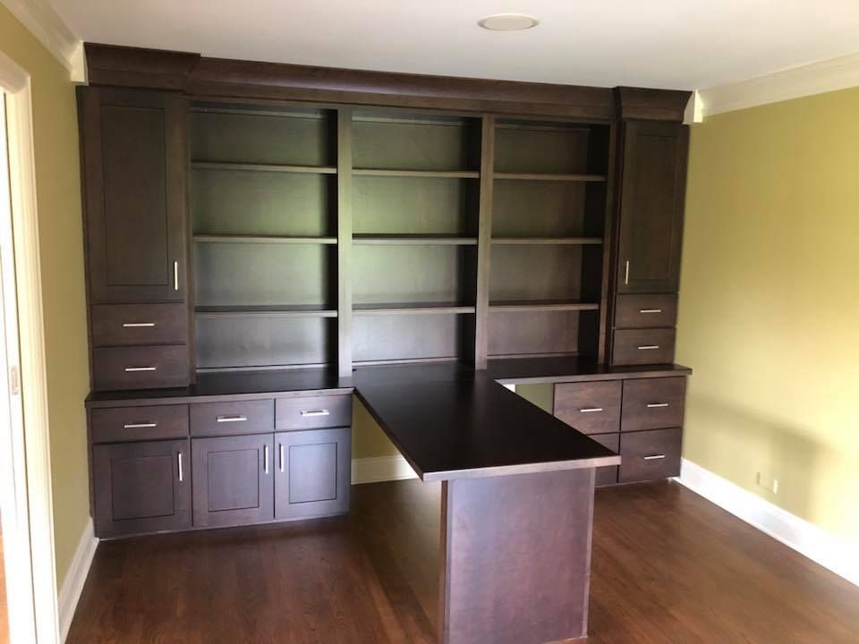 A & R Home Services remodel  room with a desk and shelves 