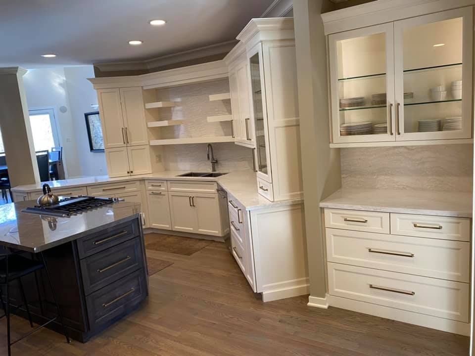 A & R Home Services remodel kitchen with white cabinets and a large island.
