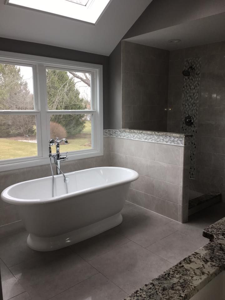 A & R Home Services remodel bathroom with a bathtub and a shower.