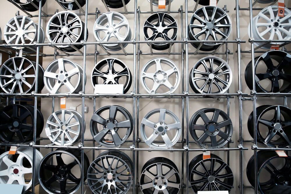 A Wall Filled With A Variety Of Wheels And Tires β Carite Auto Repairs In Warana, QLD