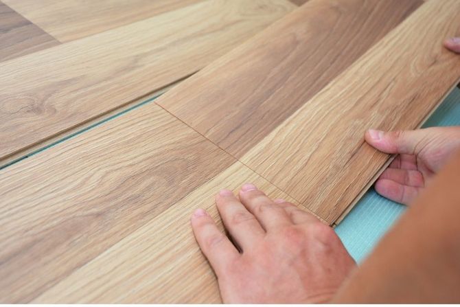 Flooring Nottingham: installing laminate flooring in a living room at a home in Nottingham