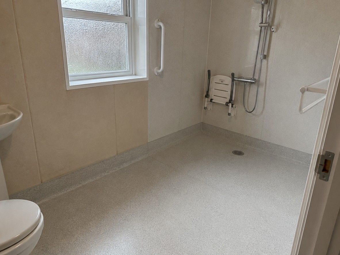Non-slip wet room flooring fitted in an accessible level access shower room