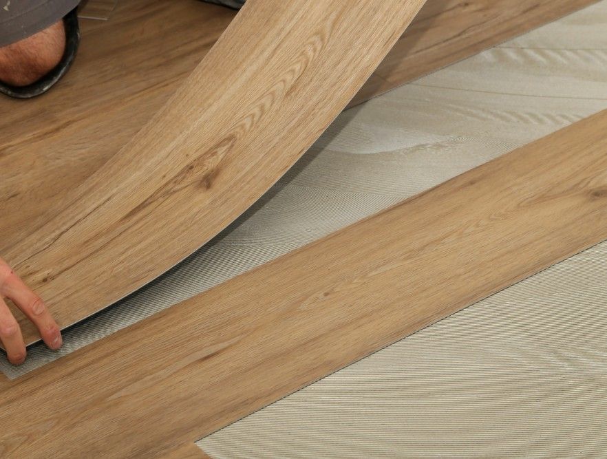 Flooring Nottingham installing LVT plank flooring at a home in Nottingham