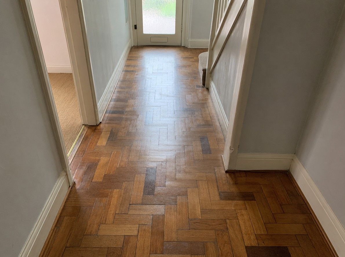 Original parquet flooring restored and refinished in a Nottingham hallwayn