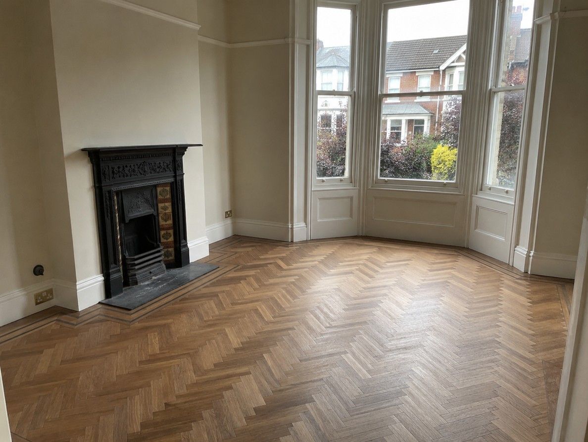Solid wood herringbone flooring fitted in a Nottingham living room