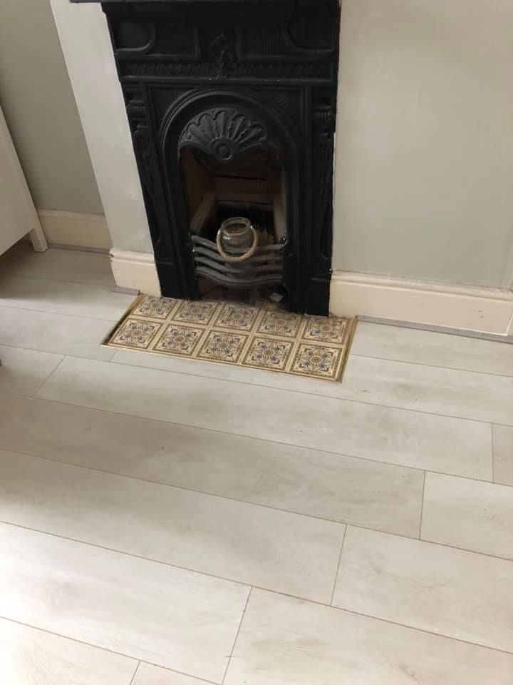 Laminate floor fitted around a fireplace in Bakersfield, Nottingham 