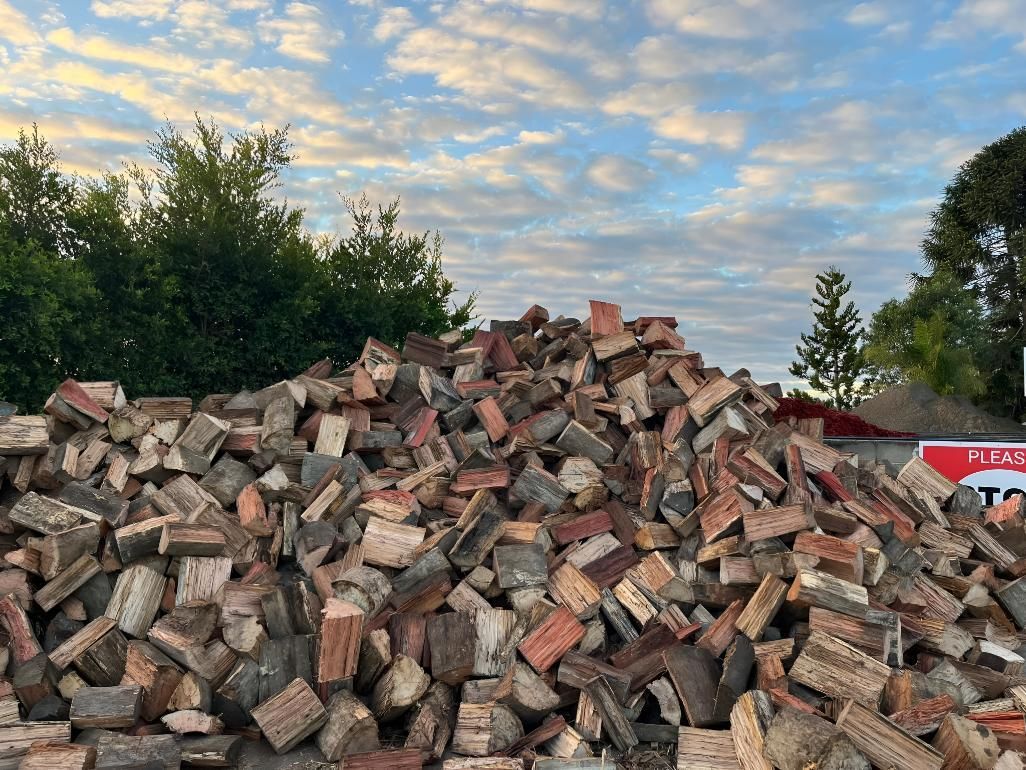 A Large Pile of Bricks is Sitting on Top of a Dirt Field — Manning Valley Landscapes in Coolongolook, NSW