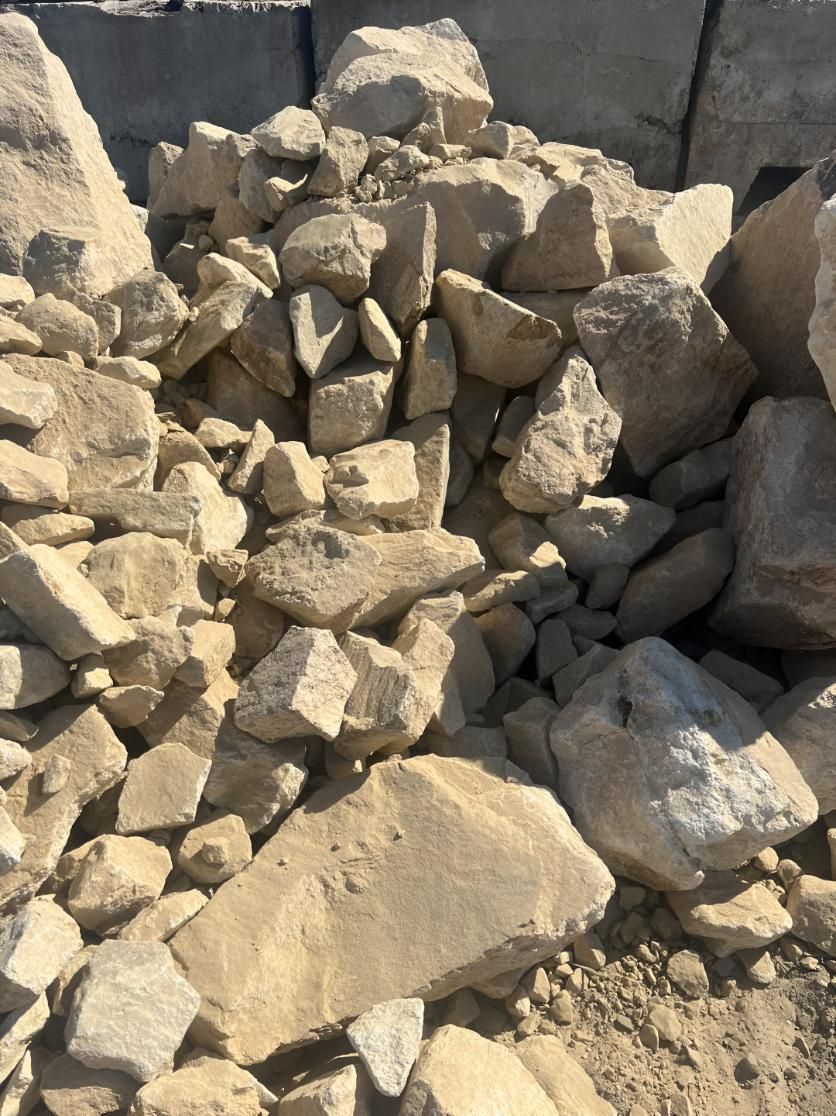 A Pile of Rocks is Sitting in the Dirt — Manning Valley Landscapes in Hallidays Point, NSW
