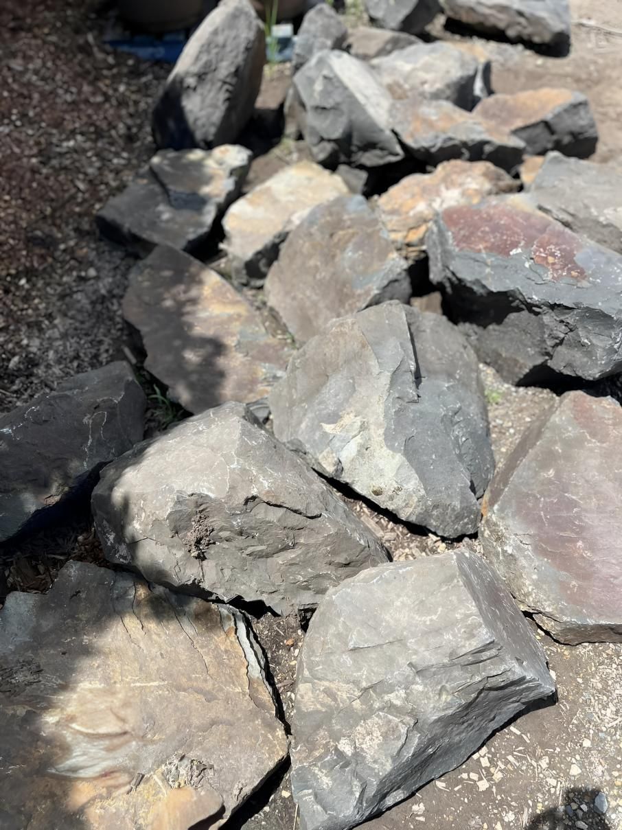 A Pile of Rocks Sitting on Top of Each Other on the Ground — Manning Valley Landscapes in Taree, NSW