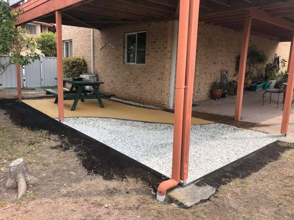 Gravel and Tan Paved Patio Area With Picnic Table — Manning Valley Landscapes in Hallidays Point, NSW