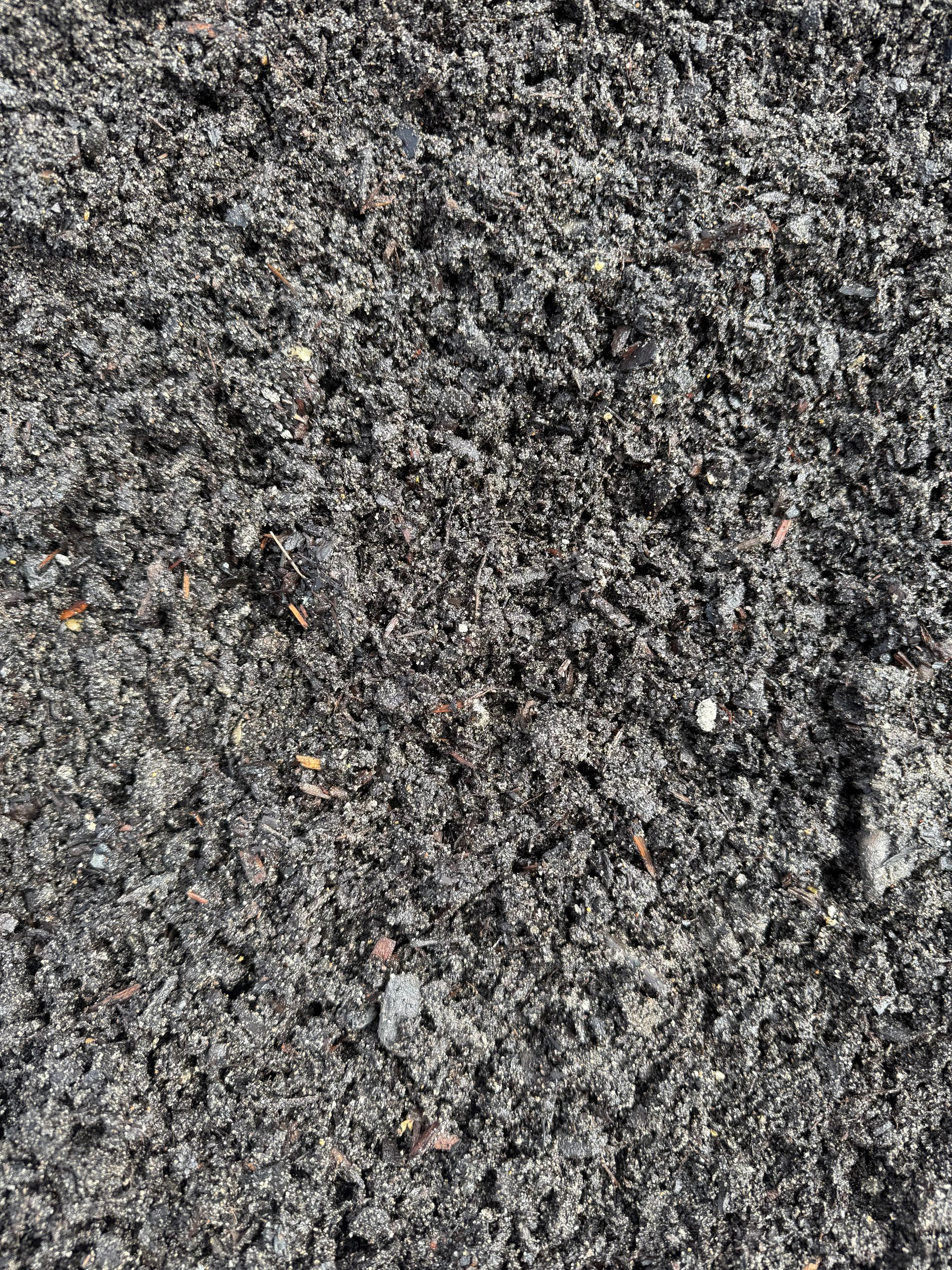 Close-Up of Dark, Rich Soil with A Textured, Crumbly Appearance — Manning Valley Landscapes In Wingham, NSW