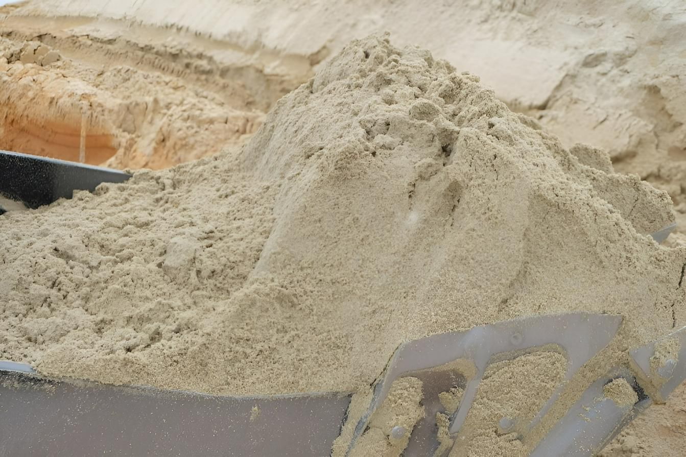 A Pile of Sand is Being Poured Into a Wheelbarrow — Manning Valley Landscapes in Coolongolook, NSW 