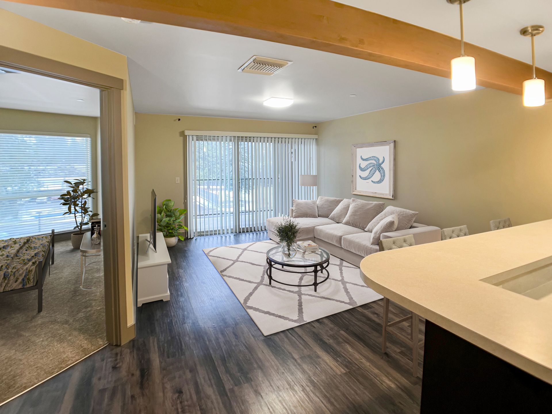 A living room with a couch , table , and television.