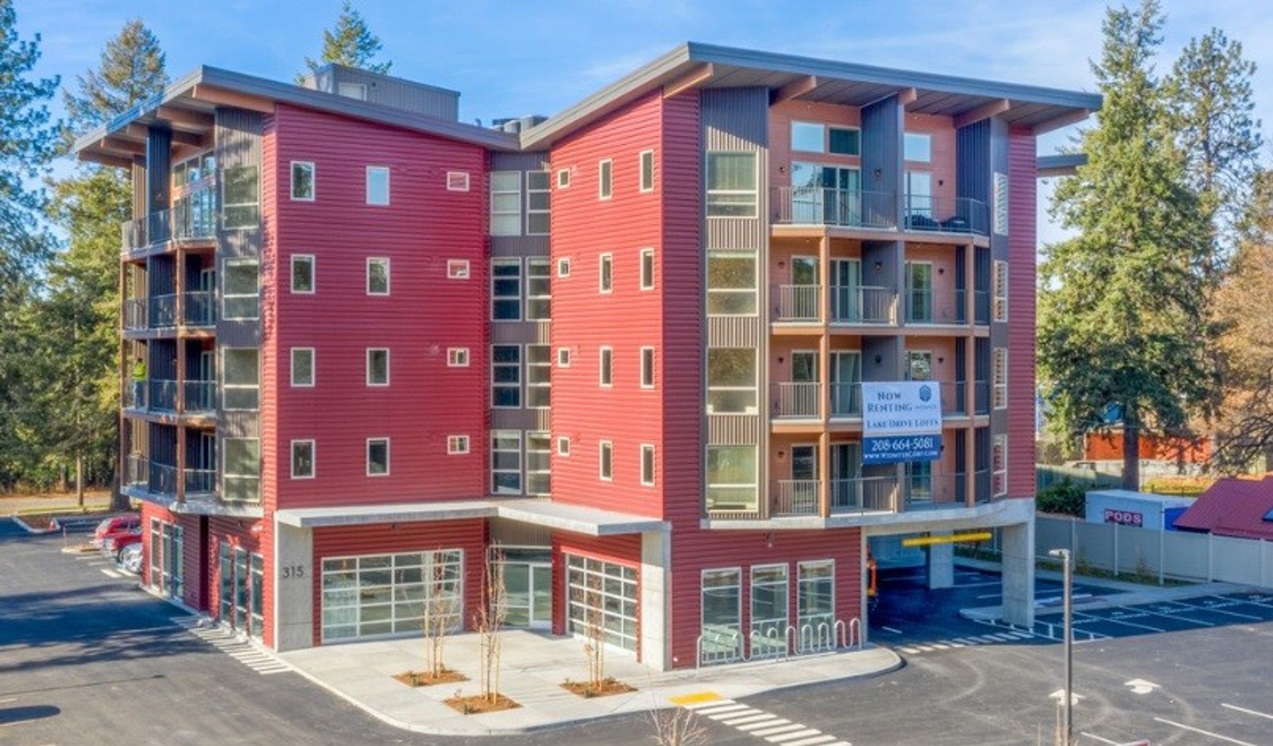 A large red building with a lot of windows and balconies