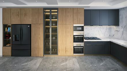 Modern kitchen with black appliances, wood and gray cabinets, and a stone countertop.