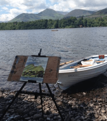 A painting on an easel next to a boat that says ' unanswerable ' on it