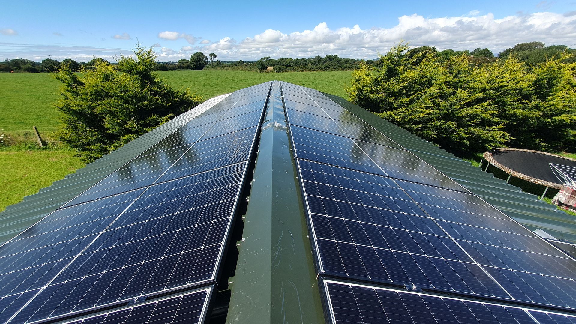 A roof with a lot of solar panels on it
