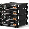 Stack of five black battery storage units, with orange terminals and control panels.