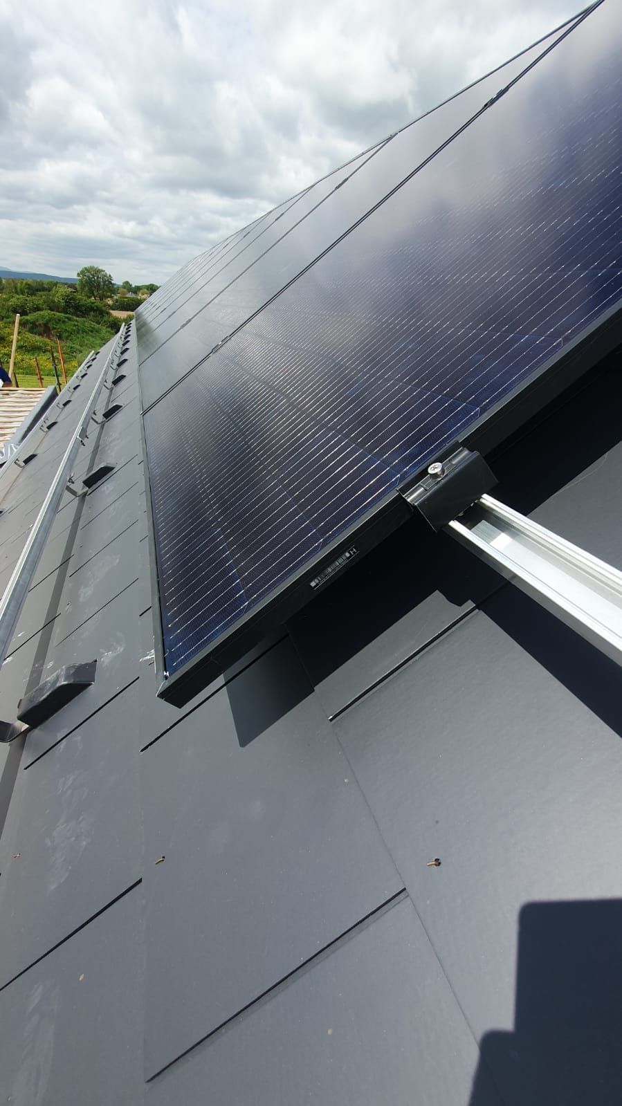 A close up of a solar panel on a roof.