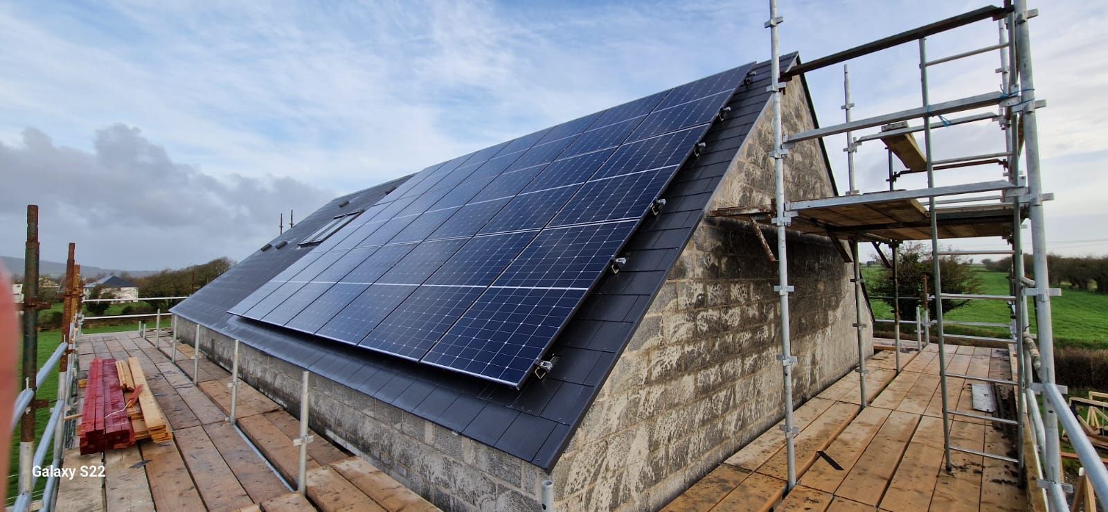A roof with a lot of solar panels on it