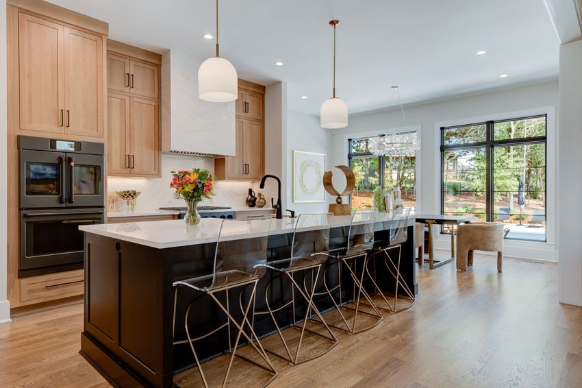 There is a large island in the middle of the kitchen.