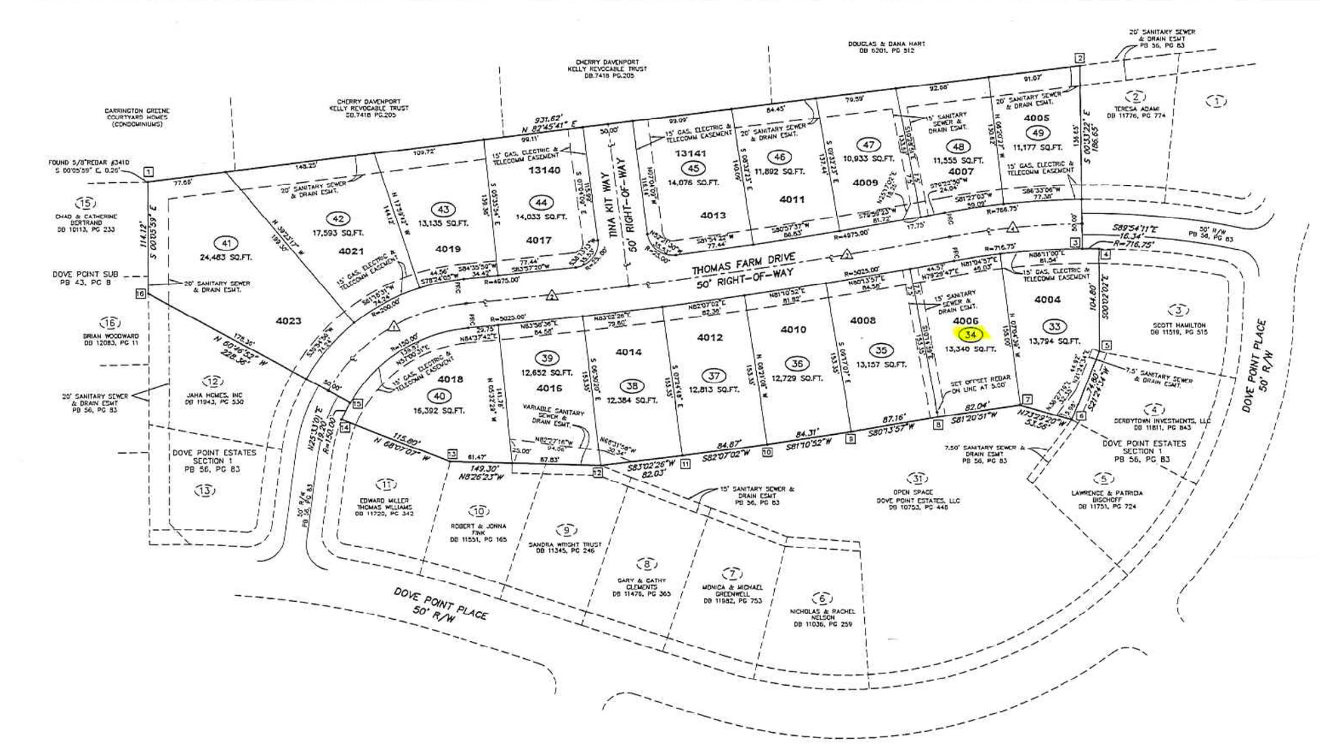 Hand-drawn site plan map with many labeled lots and roads, mostly black and white with a few colored highlights