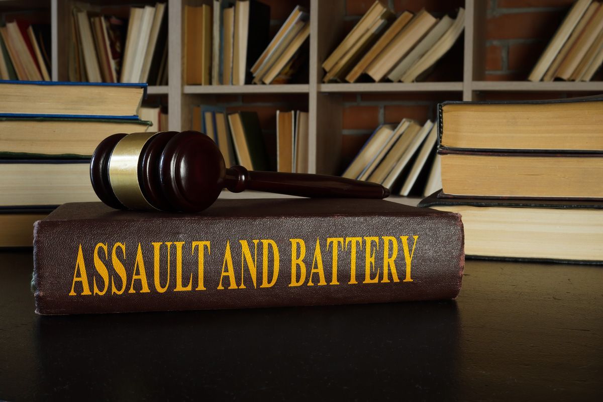 Assault and Battery Book with Gavel — Yuba City, CA — Law Office of Geoffrey J. Heitman