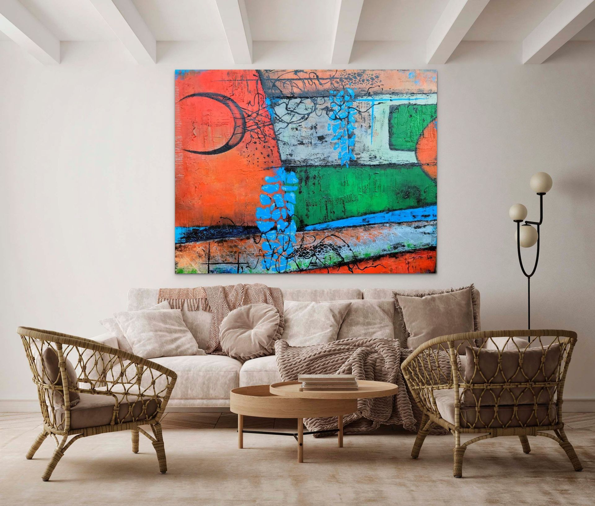 A bright, abstract painting with orange, green, and blue blocks hangs above a beige sofa and two wicker armchairs.