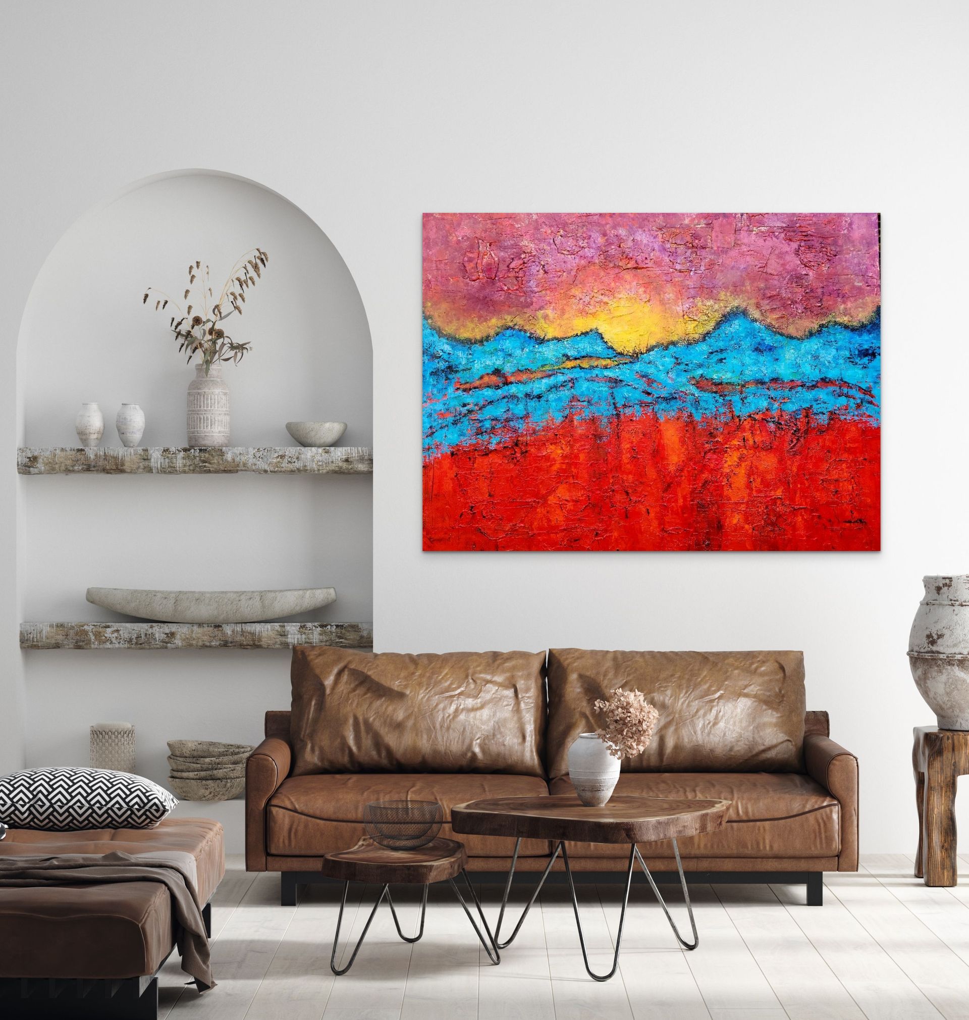 A living room with a leather couch and a large abstract painting featuring horizontal bands of red, blue, and pink.