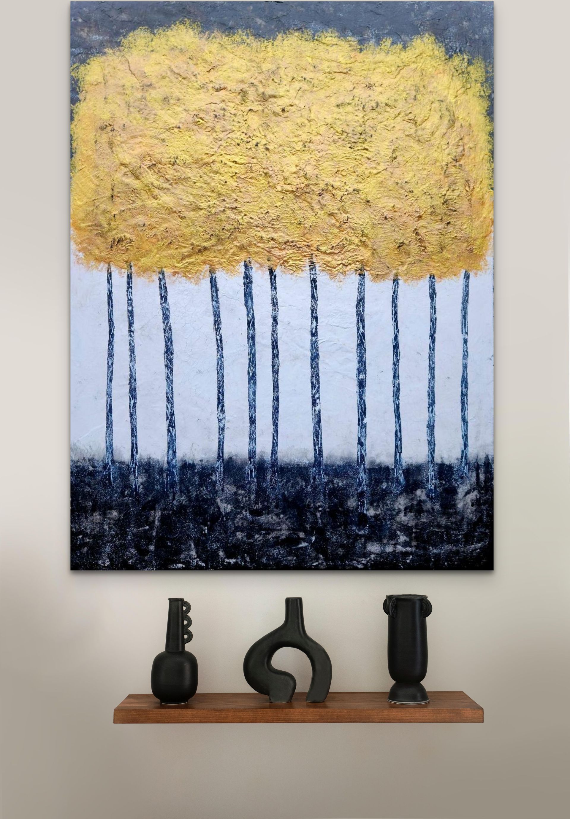 Textured yellow canopy above dark tree trunks on a white background, hanging above a shelf with three black vases.