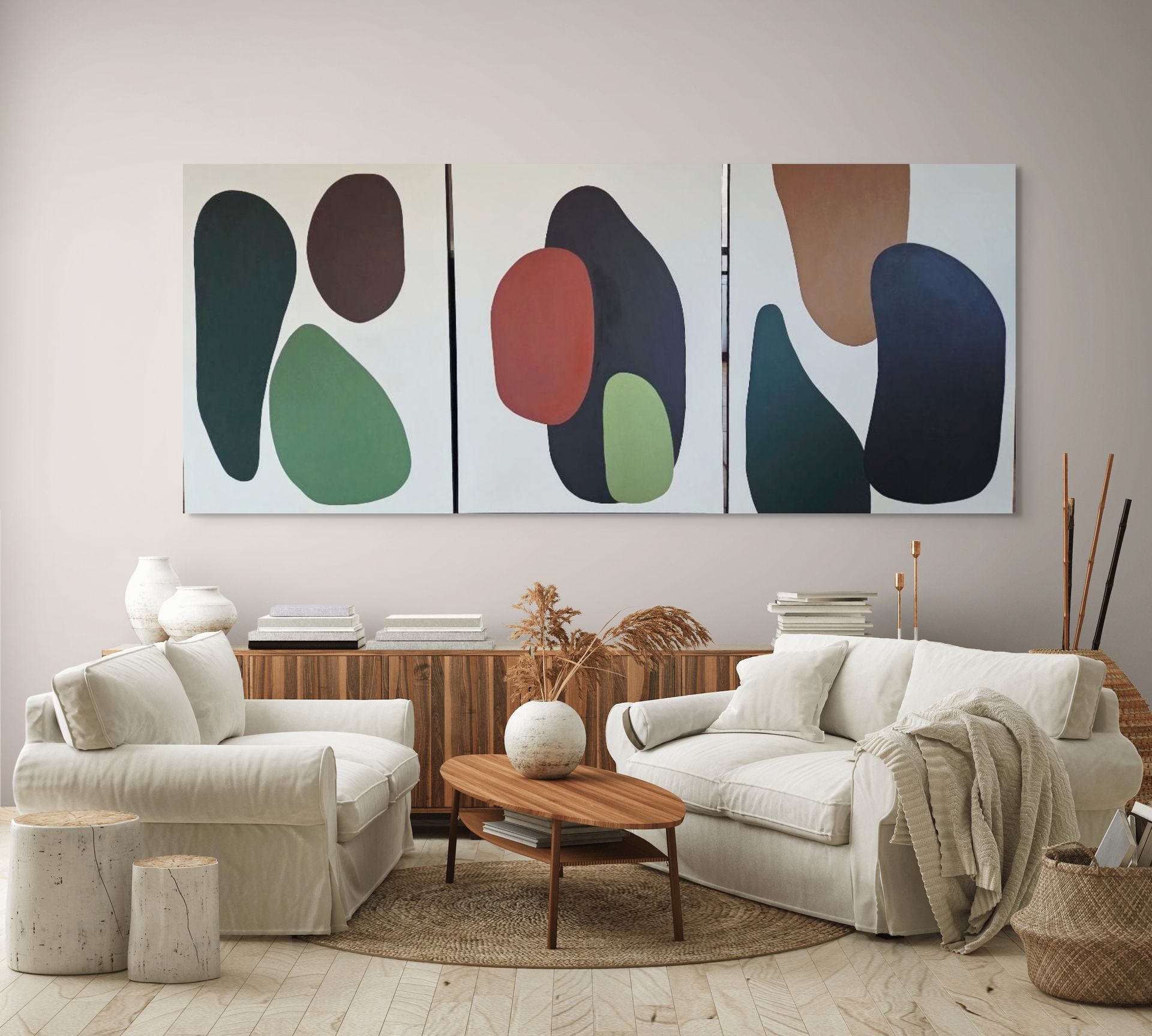 Modern neutral living room with cream sofas, a wooden coffee table, and abstract wall art
