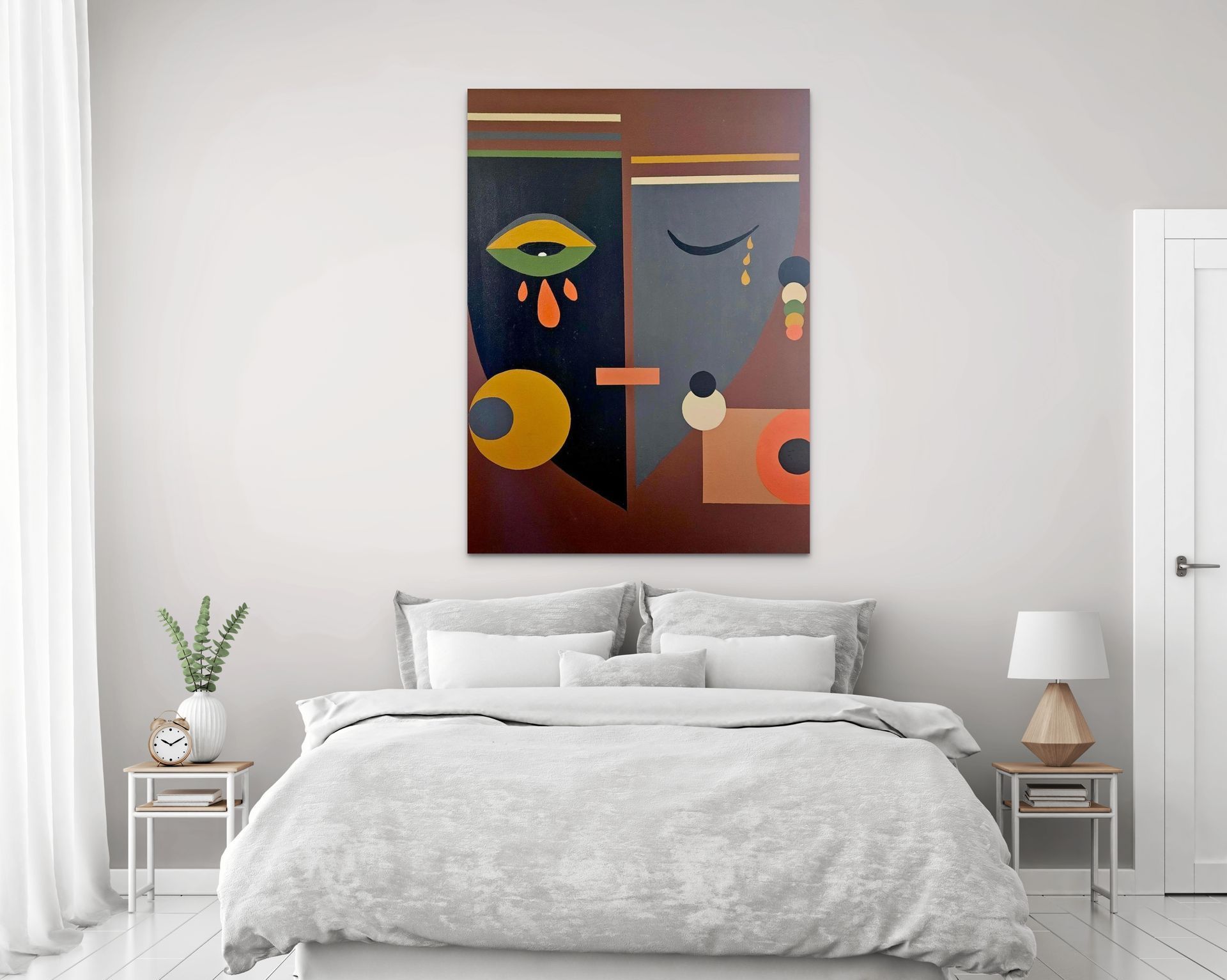 Abstract artwork with geometric shapes and eyes hanging above a bed in a modern, neutral-toned bedroom.