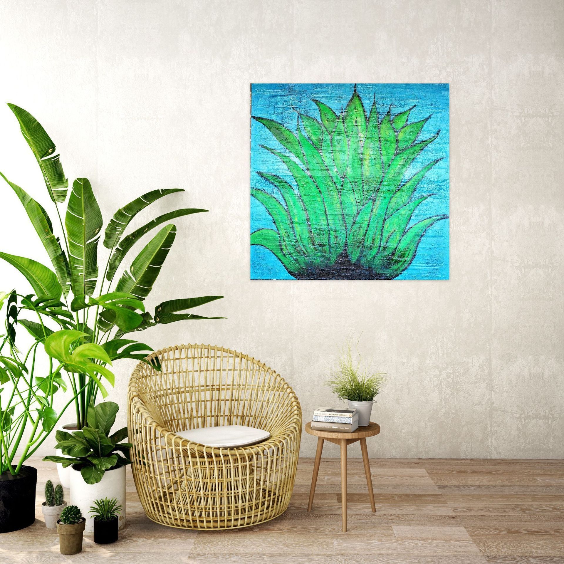 A bright green agave painting hangs on a white wall above a wicker chair, a side table, and several potted houseplants.