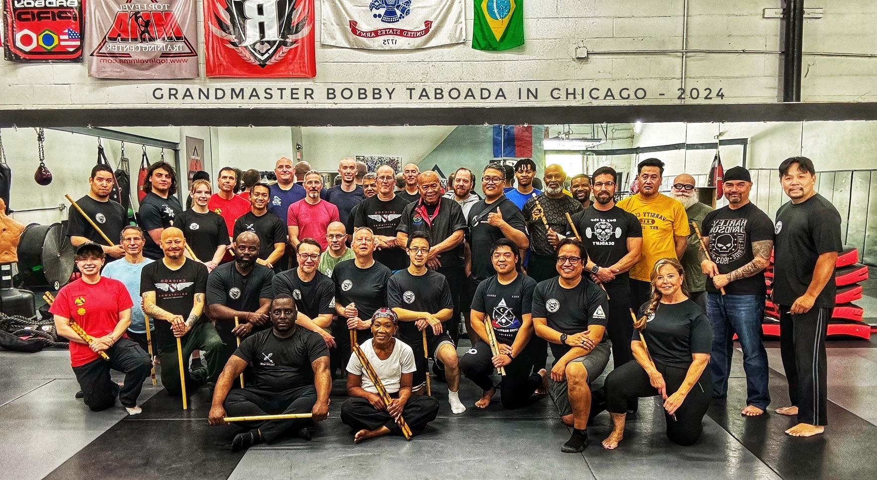 Group picture of Grandmaster Bobby Taboada Chicago-area seminar participants grouped around the Grandmaster.